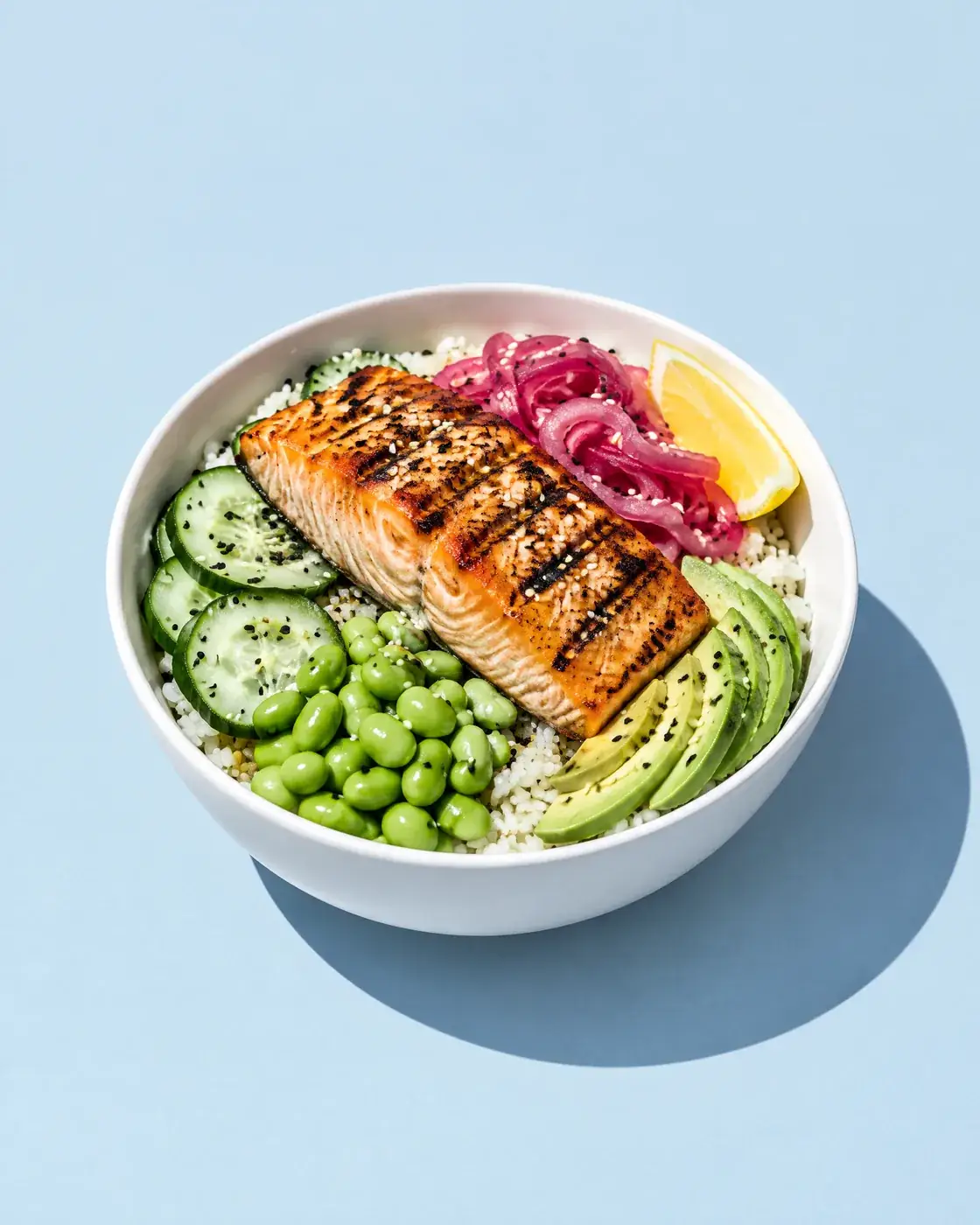 Bowl with grilled salmon, seen from above at an angle